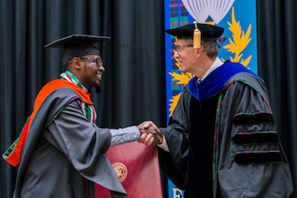 graduate shaking hands with provost