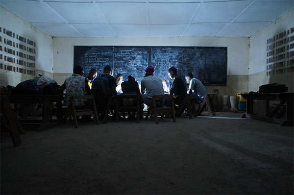 students studying by electric lamps