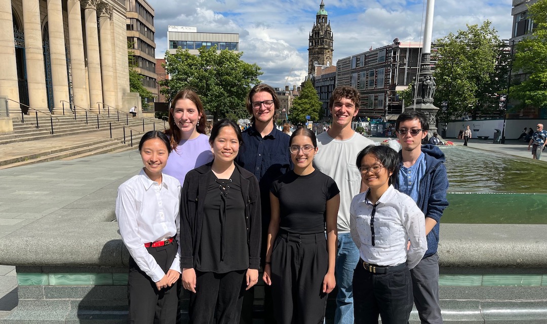 group photo of eight student participants outside