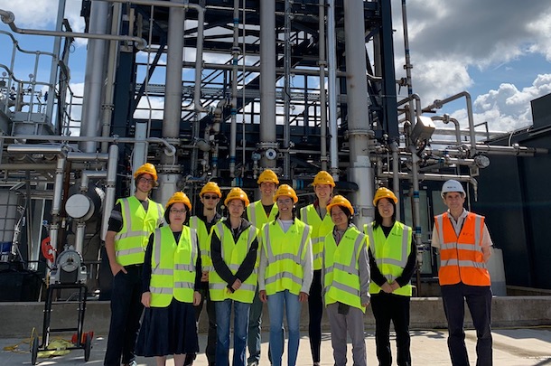 Students wearing hard hats posed in front of TERC facility