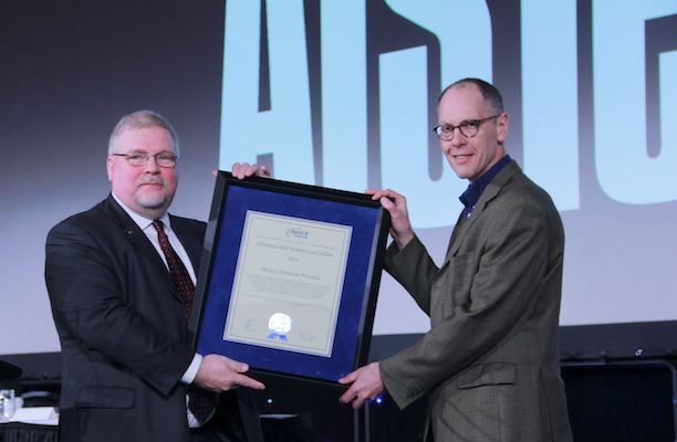 Chris Pistorius is handed his award from Barry Schneider 