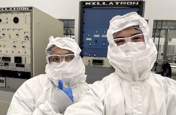 Two students in bunny suits in nano lab