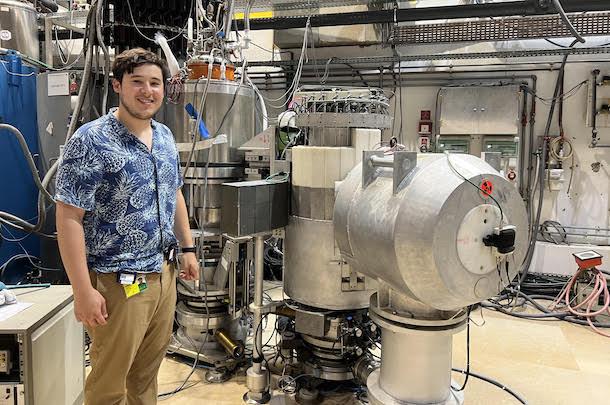 Chamorro standing in front of research equipment